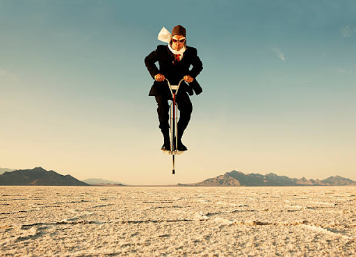a man in aviator gear jumping on a pogo stick